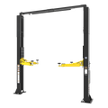 Two-post automotive lift installed in a vehicle service bay