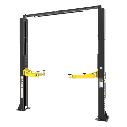 Two-post automotive lift installed in a vehicle service bay